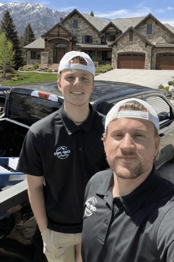 Two men in Chip Pro Autoglass uniforms.