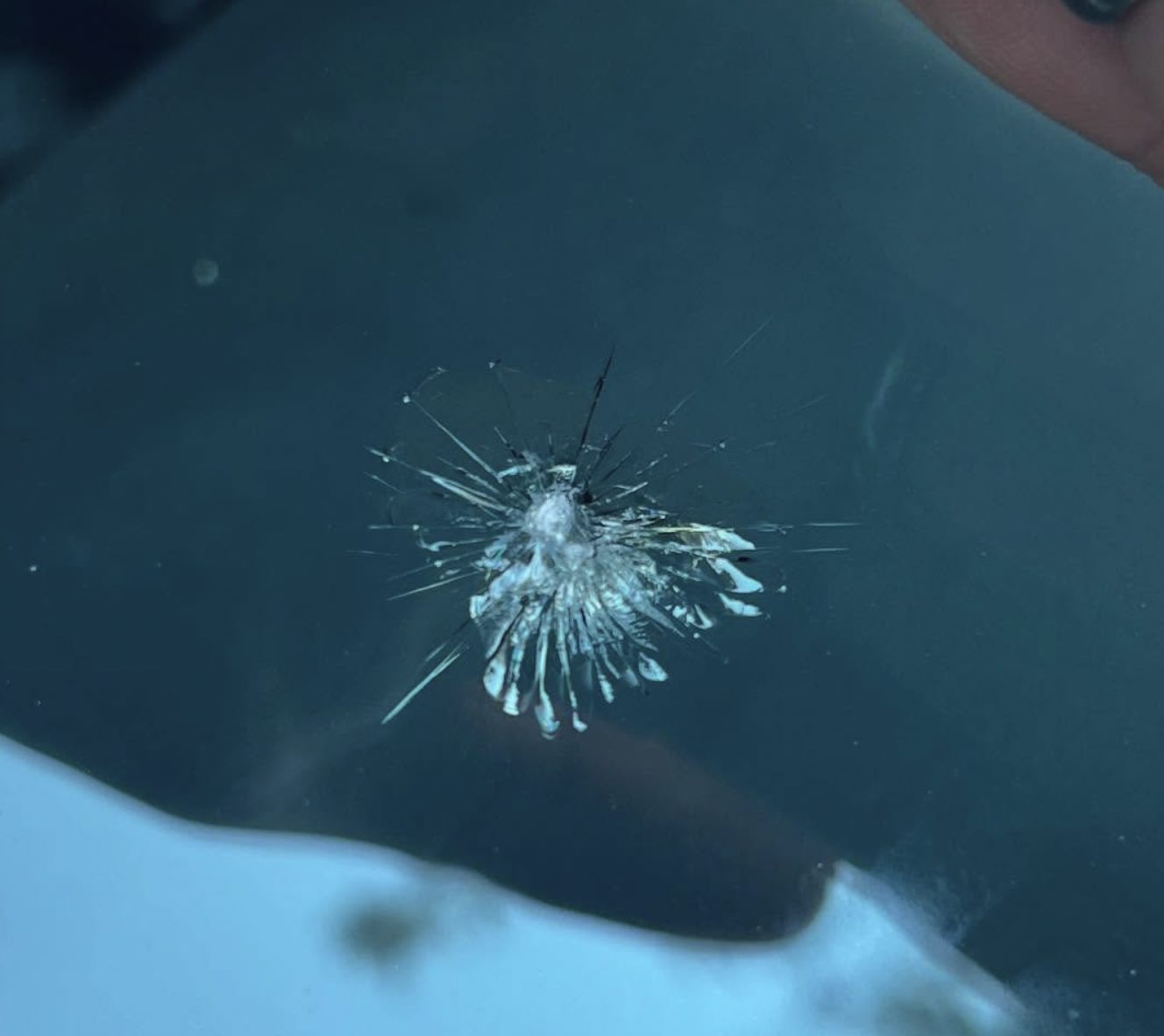 Large windshield chip before it's repaired